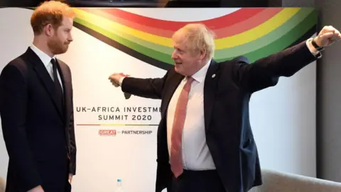 Getty Images Prince Harry meeting Boris Johnson at an investment summit in London