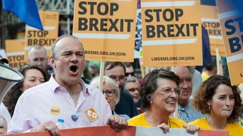 Getty Images Lib Dem leader Ed Davey marching with activists at an anti-Brexit rally in 2019