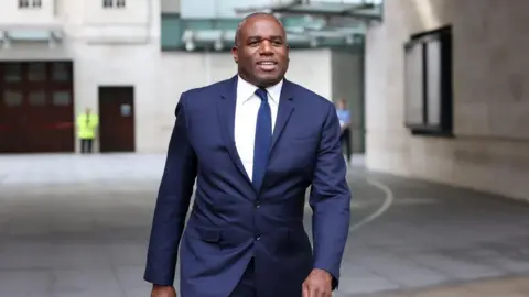 Reuters Foreign Secretary David Lammy walks outside the BBC's Broadcasting House