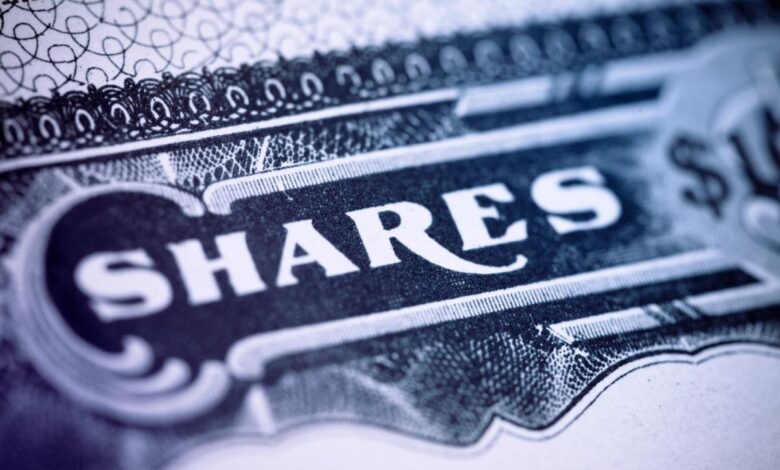 An up-close view of the word, Shares, on a paper stock certificate of a publicly traded company.