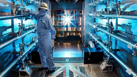 Damien Jemison A technician adjusts some of the optical equipment of the National Ignition Facility.