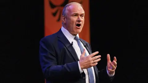 EPA-EFE/REX/Shutterstock Sir Ed Davey giving his speech at the party's annual conference