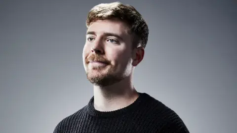 Steven Kahn MrBeast, a young man with short brown hair and facial hair.