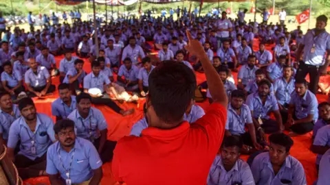 Reuters Mandatory Credit: Photo by RAGUL KRUSHAN/EPA-EFE/REX/Shutterstock (14722561j)
A member of CITU (Centre of Indian Trade Unions) addresses workers of Samsung India Electronics participating in a strike in Chennai, Tamil Nadu, India, 16 September 2024. According to K Shanmugam, a senior police officer, the Kancheepuram district Tamil Nadu police detained over 100 Samsung workers striking at the Samsung home appliance plant situated near Chennai as they were planning to hold a march on without the necessary permission from the authorities, demanding better wages, and have been on strike for a week.
Tamil Nadu police detain Samsung workers striking at Samsung home appliance plant in Chennai, India - 16 Sep 2024