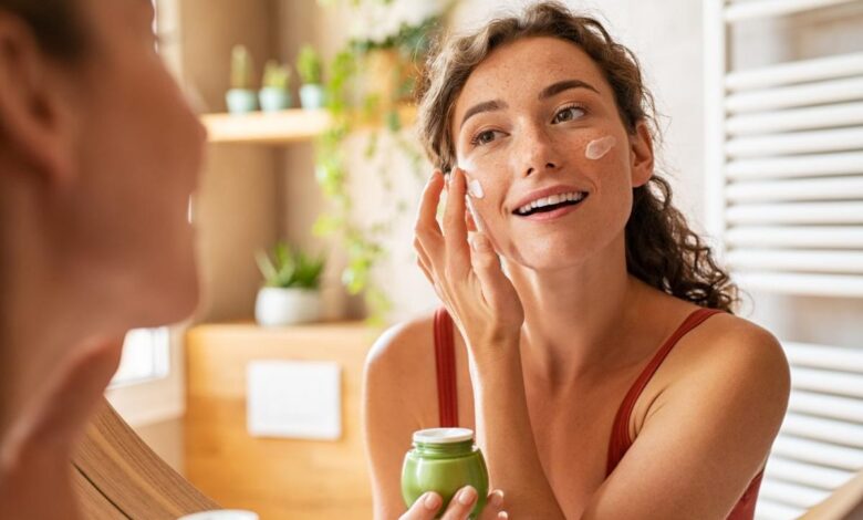 A person putting a facial ointment on.