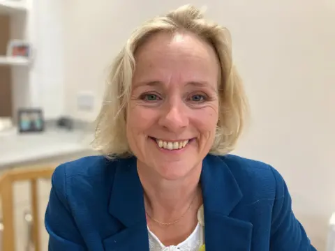 Andrew Sinclair/BBC Former MP Vicky Ford wearing a blue jacket smiles for the camera