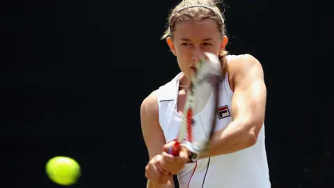 Getty Images Former tennis player Dr Anna Fitzpatrick playing a tennis match in 2011