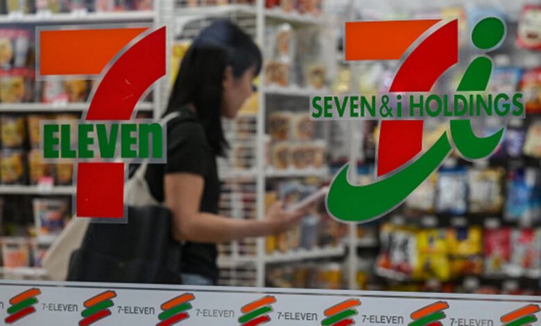 7-Eleven's parent company cuts full-year earnings forecast, presses ahead with restructuring