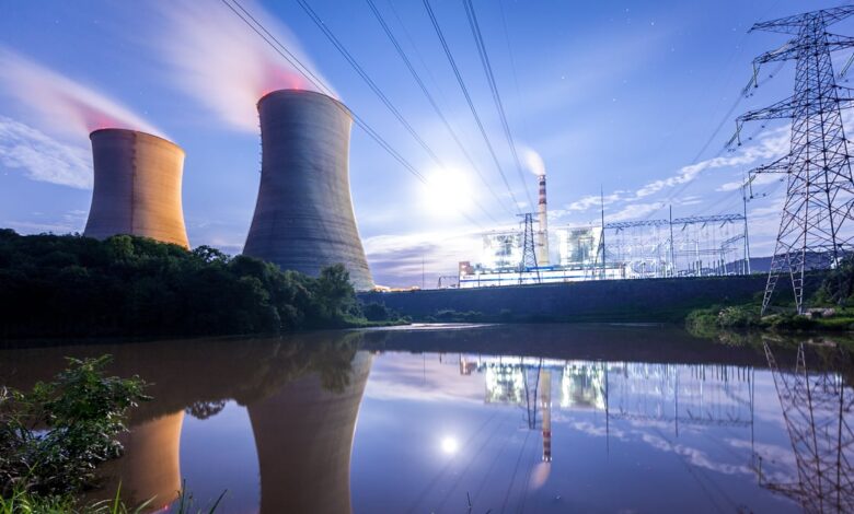 A nuclear power plant with power lines running overhead.