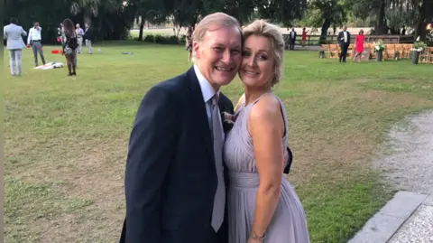 Katie Amess Katie Amess in a lilac dress with her father Sir David Amess