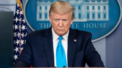 President Trump addressing reporters behind the White House podium.