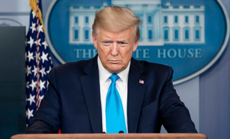 President Trump addressing reporters behind the White House podium.