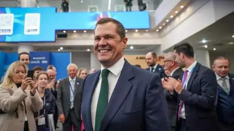 Getty Images Robert Jenrick leaving the main hall after giving his speech on the final day of the Conservative conference in Birmingham