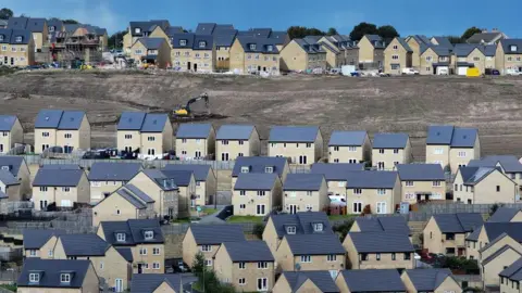 Getty Images An aerial view of a recently built development of mixed priced homes in Bradford, England