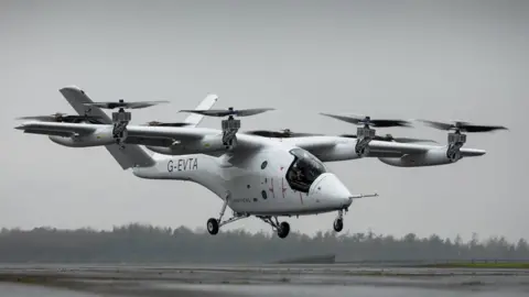 Vertical Aerospace The VX4 prototype aircraft from Vertical Aerospace takes off. It has four propellers which can rotate. 