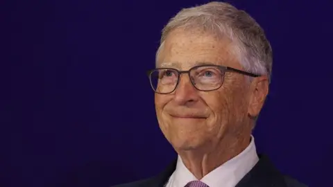 Reuters Bill Gates wearing a suit and glasses is pictured at an event at a hotel in New Delhi