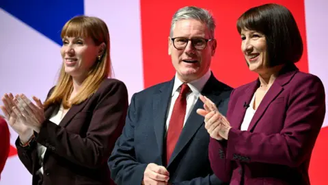 AFP Deputy Prime Minister, and Secretary of State for Housing, Communities and Local Government Angela Rayner, Britain's Prime Minister Keir Starmer and Britain's Chancellor of the Exchequer Rachel Reeves on stage on the second day of the annual Labour Party conference in Liverpool, north-west England, on September 23, 2024.