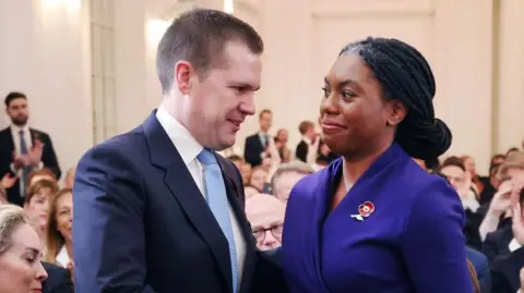 EPA Robert Jenrick shakes Kemi Badenoch's hand to congratulate her after she was announced as the new leader of Britain's Conservative Party