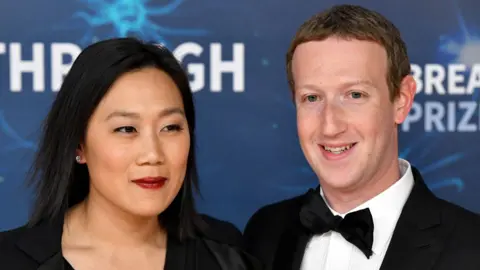 Getty Images Mark Zuckerberg (right) and wife Priscilla Chan, pictured together dressed smartly at the 2020 Breakthrough Prize Ceremony at NASA Ames Research Center