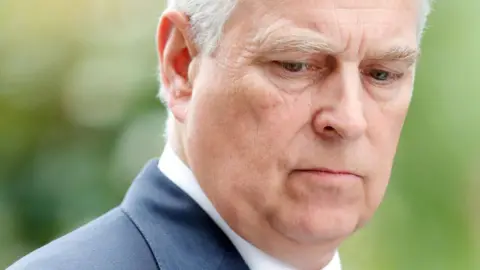 Getty Images Prince Andrew in a suit looking towards the ground