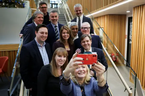 PA Media Deputy Prime Minister Angela Rayner, the Mayor of London Sadiq Khan and Mayor of West Yorkshire Tracy Brabin pose for a selfie with regional mayors in Leeds