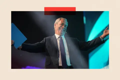 Getty Images Nigel Farage in a suit, smiling with his arms outstretched 