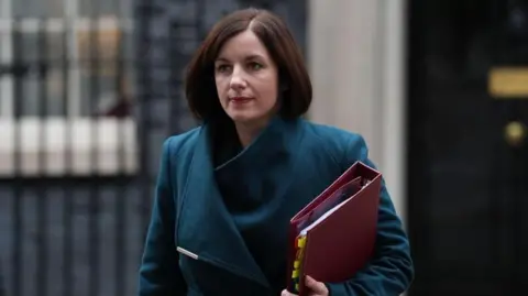 PA Media Education Secretary Bridget Phillipson, wearing a coat and carrying a red folder, leaves 10 Downing Street following a cabinet meeting