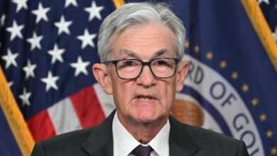 Fed holds rates steady, takes less confident view on inflation