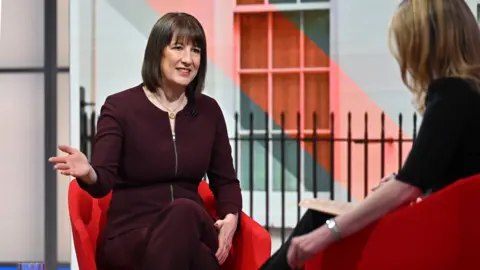 Jeff Overs/BBC Rachel Reeves being interviewed by Laura Kuenssberg in the studio