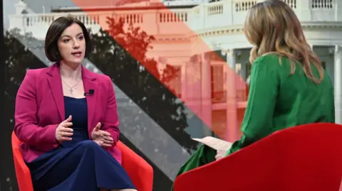 Bridget Phillipson sits in a red chair facing the BBC's Laura Kuenssberg 