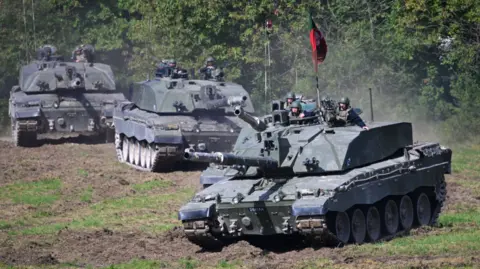 Getty Images Challenger 2 main battle tanks are displayed for the families watching The Royal Tank Regiment Regimental Parade