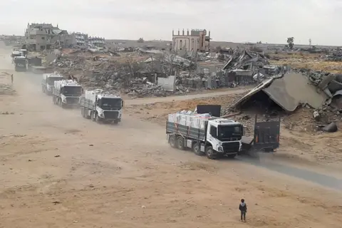 Reuters Trucks carrying aid move, amid a ceasefire between Israel and Hamas, in Rafah in the southern Gaza Strip, February 5, 2025