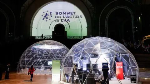 Getty Images Two large clear indoor domes in front of the logo which reads 