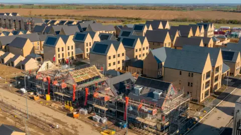 Getty Images Drone view of a residential building site under construction