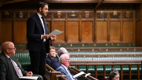 Reuters Leicester South MP Shockat Adam speaks in the House of Commons from the backbenches during a debate earlier this year