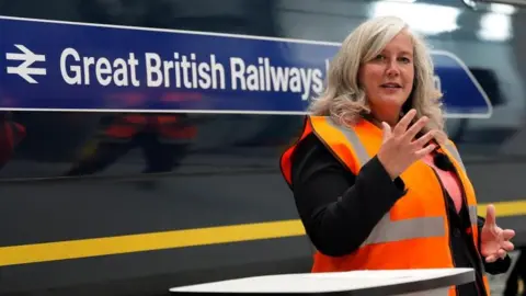 PA Transport Secretary Heidi Alexander in front of a train carriage with Great British Railways branding, during a visit to the South Western Railway Bournemouth Traincare Depot in Dorset