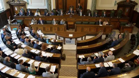 BBC Overhead shot of the council meting.