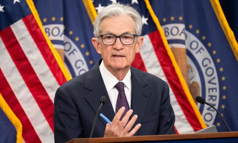Fed holds key rate steady, still sees two more cuts this year