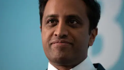 Getty Images Close shot of former Reform UK chairman Zia Yusuf, wearing a suit, with light blue blurry background