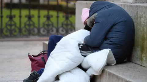 PA File photo dated 16/01/2020 of homeless people sleeping on the plinth of the Ferdinand Foch equestrian statue in Victoria, London.