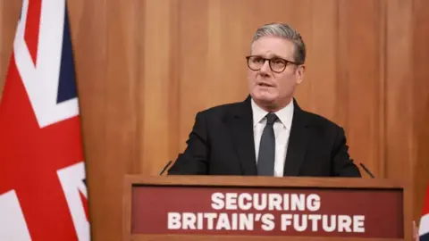 PA Keir Starmer giving a speech on immigration in Downing Street in May.
