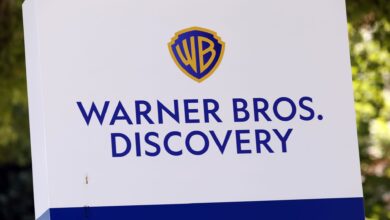 Stocks making the biggest moves midday: Warner Bros. Discovery, Topgolf Callaway, EchoStar, Apple and more