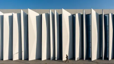 Khazna The exterior of a Khazna data centre in Masdar City, Abu Dhabi - it is white and has a